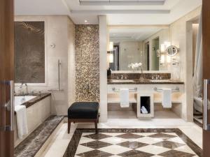 a bathroom with a sink and a fireplace at Raffles Makkah Palace in Makkah +173 photos