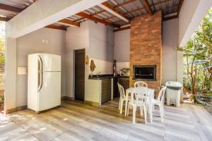 Kuchyň nebo kuchyňský kout v ubytování Green Garden Foz - Casas e Lofts em um Bosque