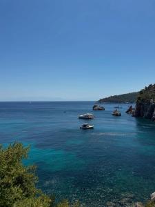 a large body of water with boats in it at Marble and Wood Retreat! in Kondodhespótion
