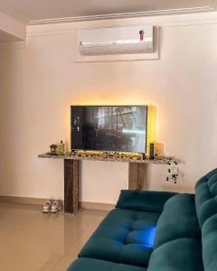 TV a/nebo společenská místnost v ubytování Apartamento em Pitangueiras - Four Seasons Guarujá