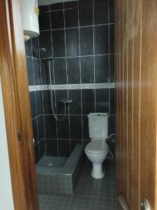 a bathroom with a toilet and a bath tub at Sako's Home 