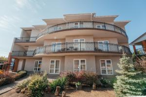 an apartment building with a balcony on top of it at Aura in Zatoka