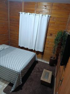 Postel nebo postele na pokoji v ubytování Chalé HN - Passinhos RS