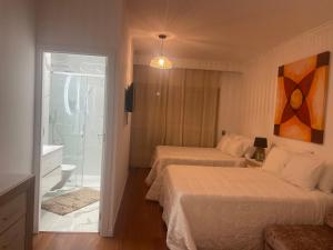 Postel nebo postele na pokoji v ubytování City World Apartment