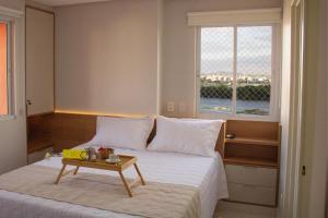 En eller flere senge i et værelse på Janelas do Rio - Apartamento 2 quartos com vista para o Rio, Wi-Fi, ar-condicionado e máquina lava e seca + 46 billeder