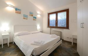 Ένα ή περισσότερα κρεβάτια σε δωμάτιο στο Cozy Home In Costa Rei