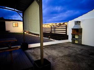 a room with a view of a balcony with a fireplace at Brisa do Nordeste in Nordestinho