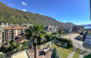 a view of a city with a palm tree at 2 Bedroom Awesome Apartment In Omegna in Omegna +17 photos