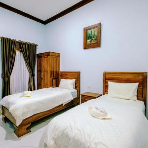 Ένα ή περισσότερα κρεβάτια σε δωμάτιο στο Martin Anugrah Hotel & Restaurant +19 φωτογραφίες