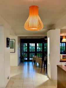 a kitchen with a large chandelier hanging from the ceiling at Harbor View 4bd by ZenBreak in Saint Michael