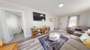 a living room with a couch and a table at 3 Bed 2 bath Pet Friendly in Historic Bates Hendricks in Indianapolis