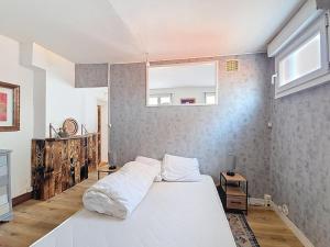 Ένα ή περισσότερα κρεβάτια σε δωμάτιο στο Le Sensée