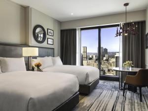 Ένα ή περισσότερα κρεβάτια σε δωμάτιο στο Sofitel Adelaide