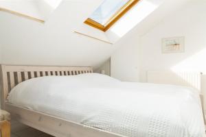 Ένα ή περισσότερα κρεβάτια σε δωμάτιο στο Nautic W19