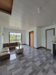 a living room with a couch and a table at Siargao Villaflor Residence in Dapa