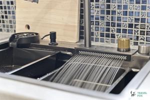 a kitchen with a sink and aaucet and a counter at Bella's House 12mins bus to Motor Point Arena Free Street Parking in Nottingham +32 photos