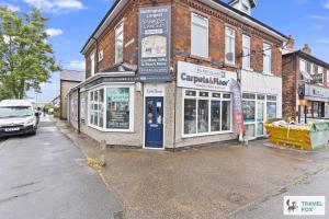 a building on the corner of a street at Bella's House 12mins bus to Motor Point Arena Free Street Parking in Nottingham