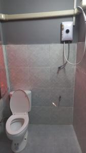 a bathroom with a toilet and a shower stall at RoXx Social Hostel in Bangkok +34 photos