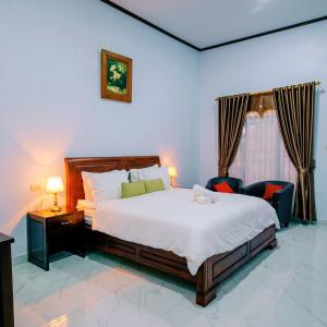 Ένα ή περισσότερα κρεβάτια σε δωμάτιο στο Martin Anugrah Hotel & Restaurant