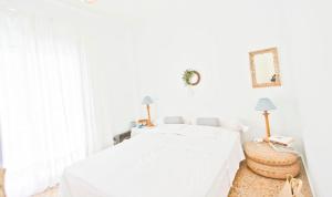 A bed or beds in a room at Coral Apartment