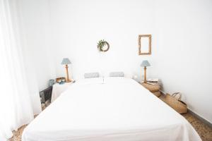 A bed or beds in a room at Coral Apartment