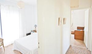 A bed or beds in a room at Coral Apartment