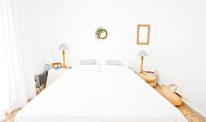 A bed or beds in a room at Coral Apartment
