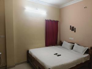 Ένα ή περισσότερα κρεβάτια σε δωμάτιο στο Dream Promenade Residency