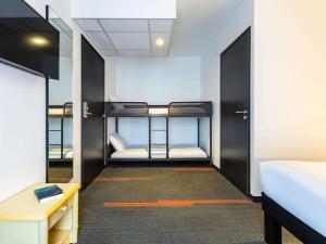 Ένα ή περισσότερα κρεβάτια σε δωμάτιο στο greet Hotel Nancy Sud