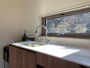 a kitchen counter with a sink and a window at 양평스테이 Private Stay Near Seoul - Entire House Just for You 
