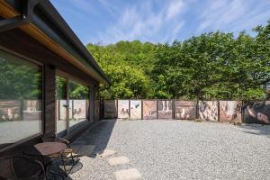 a patio with a table and chairs next to a building at 양평스테이 Private Stay Near Seoul - Entire House Just for You 