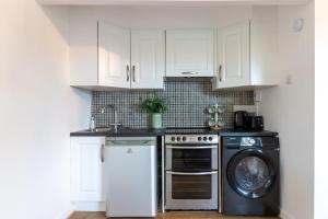 Η κουζίνα ή μικρή κουζίνα στο GuestReady - Quaint Haven in Dublin