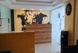 a room with a wall with a map of the world at Hotel O Tada Sri City Formerly SVS Living Space in Tada