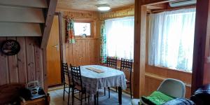 a small dining room with a table and chairs at ASFeriehus in Flekkefjord +43 photos