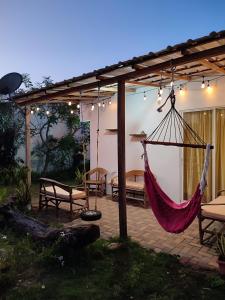a patio with a hammock and a tent at Kanus Ayangue in Ayangue