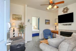 a living room with a couch and a tv at Pacific Plaza #307 - Sand Dollar - 1BdrmUp-K in Oceano