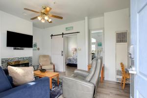 a living room with a couch and a tv at Pacific Plaza #409 - Peaceful Pearl - 1BdrmUp-K-QSofa in Oceano