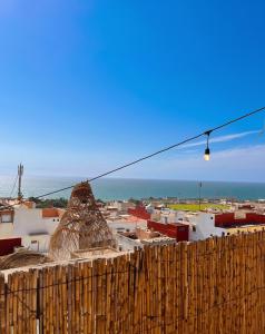 a view of a city from the top of a wooden fence at Wild Surf Morocco in Agadir