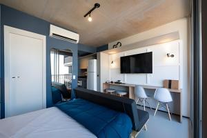 Televiisor ja/või meelelahutuskeskus majutusasutuses tampopo · rogom •Vila Mariana, AC, colado no metrô