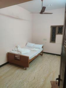 a bedroom with a bed in a room at The Ultimate stay in Puducherry