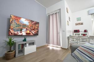 TV a/nebo společenská místnost v ubytování Maison 54 - Lago Canneto