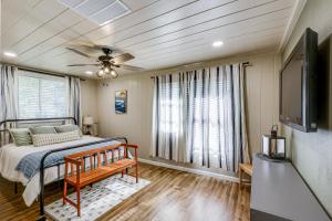 a bedroom with a bed and a ceiling fan at On-Site Creek and Spacious Yard Family Gem in Royal in Royal