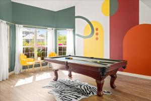 a billiard room with a pool table in the middle at Epic Mesa Getaway - Pool - Hot Tub - Game Room in Dobson Ranch