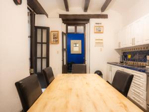 a dining room with a wooden table and chairs at Casa colonial en el corazón del Centro Histórico in Mexico City +36 photos