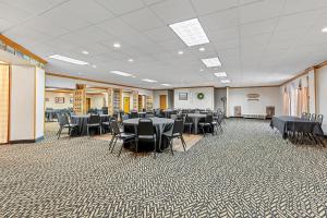 a banquet hall with tables and chairs in a room at Red Roof Inn Cambridge, OH in Cambridge