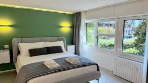 Ένα ή περισσότερα κρεβάτια σε δωμάτιο στο Modern suite near Corso Buenos Aires Lima Porta Venezia metro