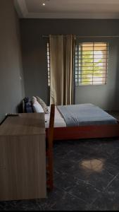 Postel nebo postele na pokoji v ubytování G Heritage Hotel