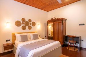 Ένα ή περισσότερα κρεβάτια σε δωμάτιο στο Sand Cliff Villa