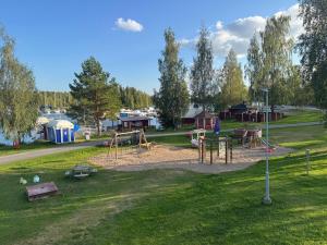 an empty playground in a park with at Gasthaus Sahanranta in Kuhmoinen