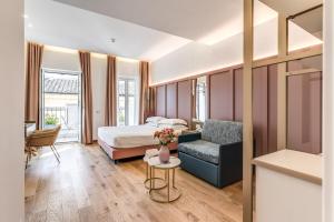 Giường trong phòng chung tại Relais Trevi 95 Boutique Hotel